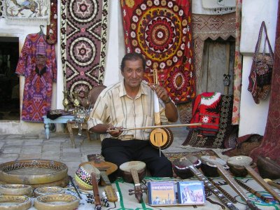 Bukhara - musical instrument seller at Caravansary