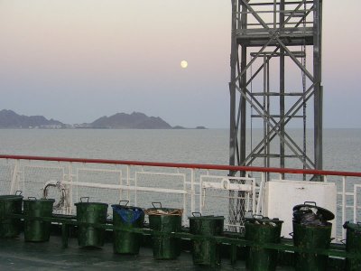 Aboard the freighter crossing the Caspian Sea - moonlight on trash cans
