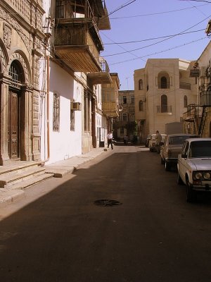 Baku - street scene. Note Ottoman style balconies on left