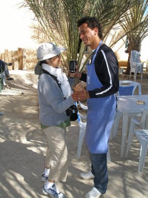 At a pit-stop cafe in Souk-Lahad/Kibili, Brenda dances with the cute proprietor