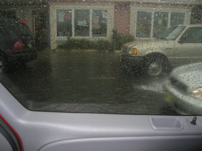 A really heavy rain flooded the street.