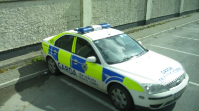 Police car tucked out of sight of traffic