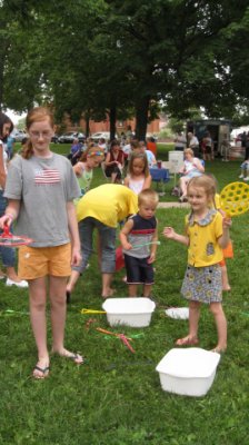 Blowing bubbles at Party in the Park