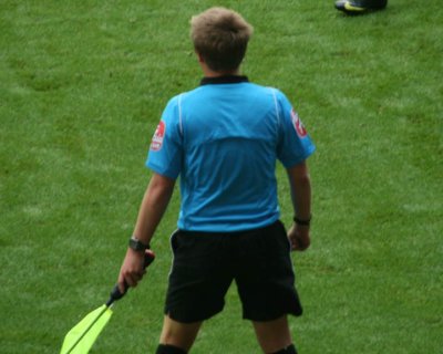 The Linesman's Bra Strap Starts to Give a Little Trouble
