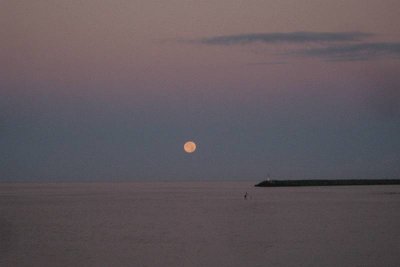 Full moon setting at dawn later
