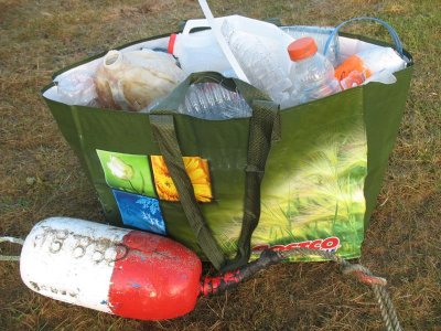 hauling out the trash in a very handy Costco reusable bag