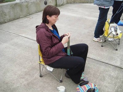 Teresa knitting waiting for parade