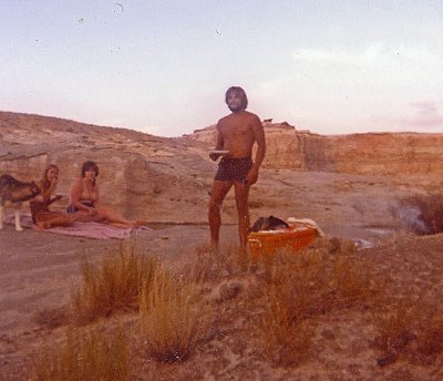  Buddy Rod cooking steaks in a sand pit along the shores of Powell. 1,900 miles of shore line and few people. 