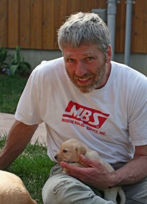 Neighbor JIm And One Of His Golden Lab Pups