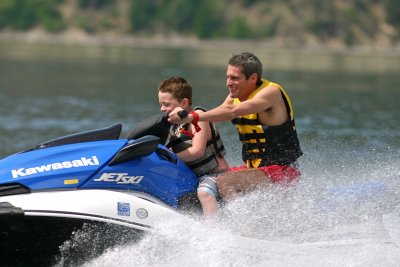  Father And Son Jet Skiing On Lake