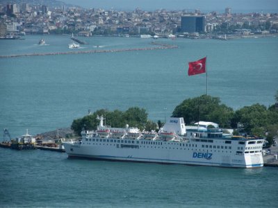  Ferry and large Turkish flag from Galata Tower . The Bosphorus beyond the Golden Horn