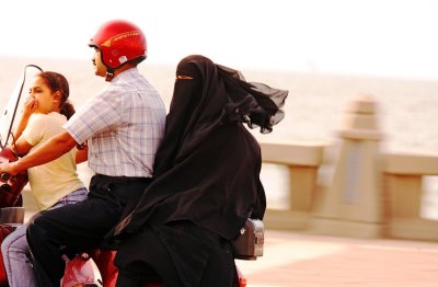 Helmeted Rider With Wife & Child