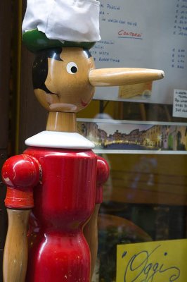 Pinocchio outside a restaurant