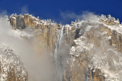 CA - Yosemite NP - Rock Face Swirling Clouds