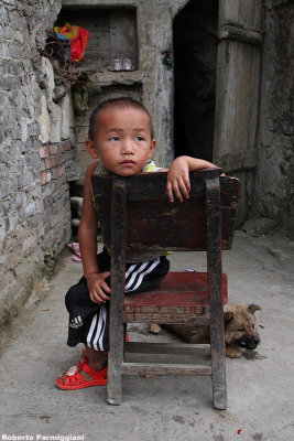 Miao child and his dog
