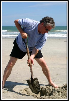 David begins sandcastle construction.