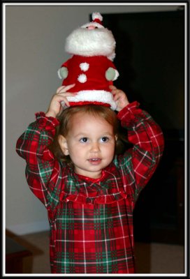 Kylie decides Santa makes a good hat