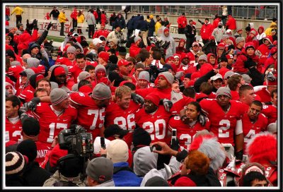 Fans and the team all sing Carmen Ohio.