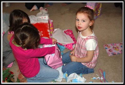 Noelle lets Ari open a present, so she can take a break from all the present unwrapping frenzy