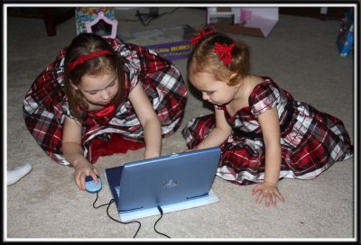 Noelle plays with her new preschool laptop from Mimi