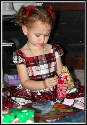 Kylie refuses to put the doll down and open the next present