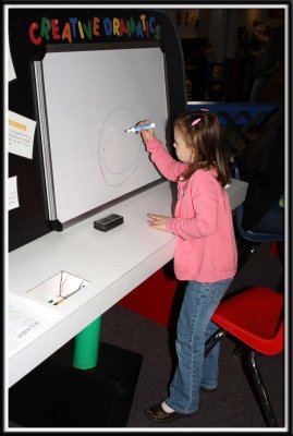 Noelle has fun inhaling dry erase marker fumes!