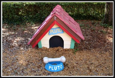 Pluto's doghouse in Mickey's backyard