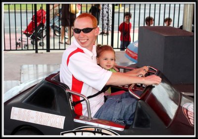 Kylie and Daddy on the race cars