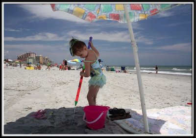 For some unknown reason Kylie got intensely engaged in squirting water into the sand. Do I see a promising future in hydraulics?