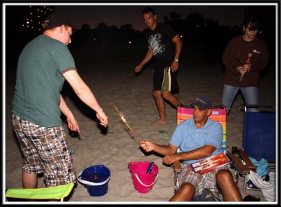 Dad mans the home base and keeps the sparklers lit!