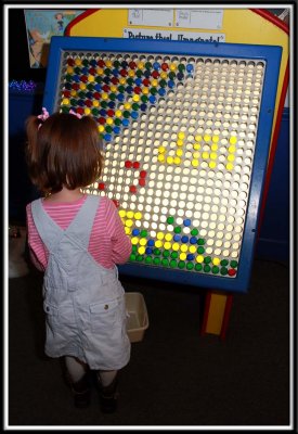 Kylie works on the giant Lite Brite