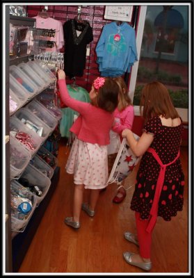 Picking out accessories for their take home bag (bracelets, mirrors, bouncy balls, lip gloss, hair bows, etc...)
