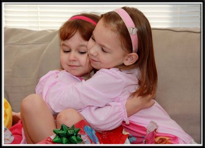 The girls chose one of their own belongings to give to each other for Christmas. And they LOVED giving it to each other.