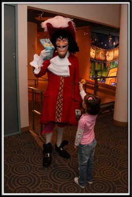Captain Hook is HIGHLY displeased with Kylie's autograph book, because Tinkerbell is on the cover. He put up a very large fuss.