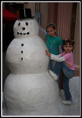 Noelle and Kylie with the snow man!
