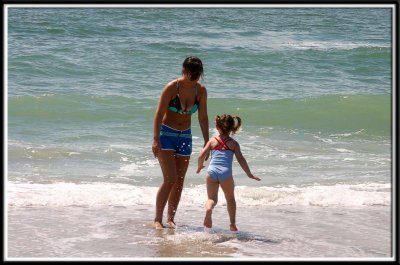 Noelle plays with Auntie in the ocean