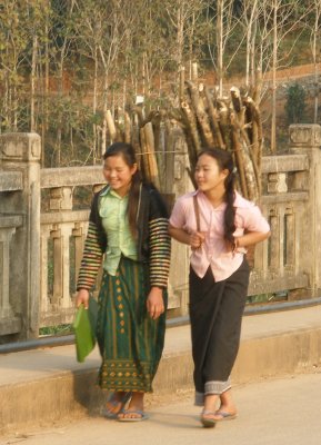 Local girls on bridge in late afternoon