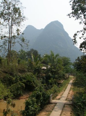 Path leading towards Buddhist temple, looking back towards the centre of Muang Ngoi