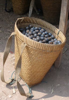 A loaded wicker basket, same village