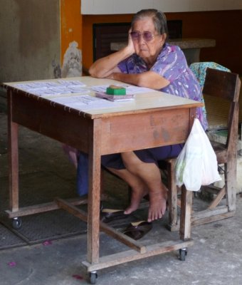 Lottery ticket seller at market, Hua Hin
