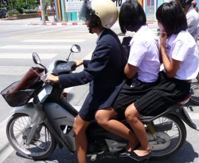 Schoolgirls on motorbike