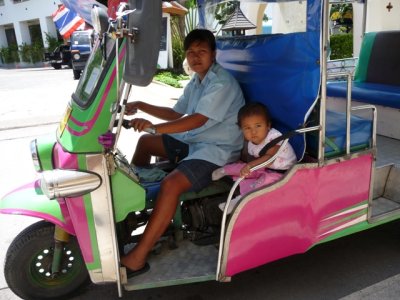 Tuktuk driver and helper