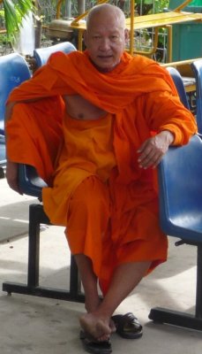 Monk waiting for train