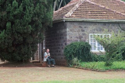 Jim takes a rest outside the house