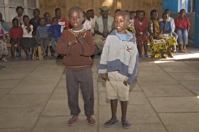 Two boys recite a poem for us