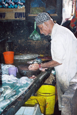 One of the fish mongers preparing his products