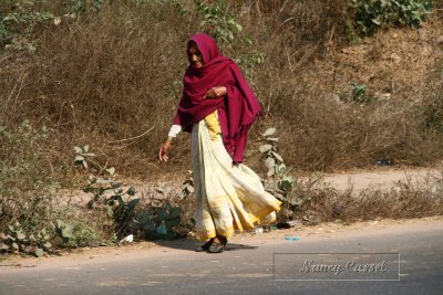 02-Woman walking on road