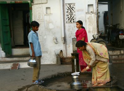 06-Woman and children at village water pump