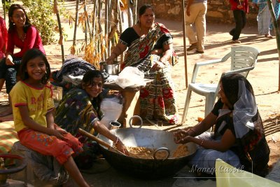 13-Women and girl making sweets
