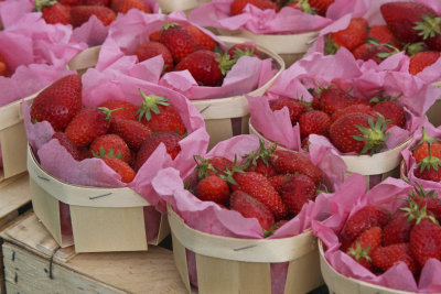 Luscious strawberries tucked in pink tissue paper.